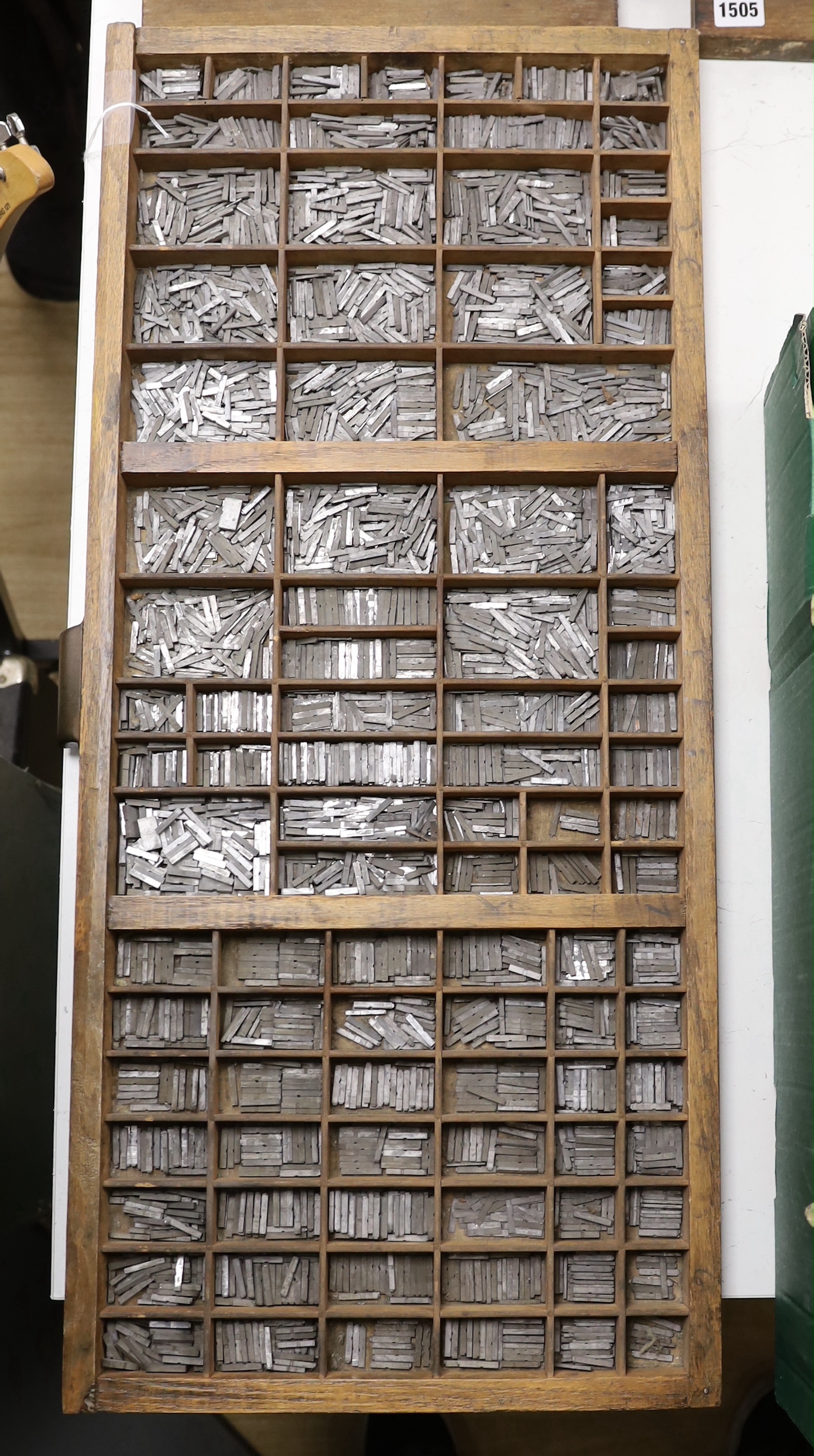 A wooden drawer with dividers as a printer's tray of type set, originally from The Argus building, Brighton, 82 x 36cm